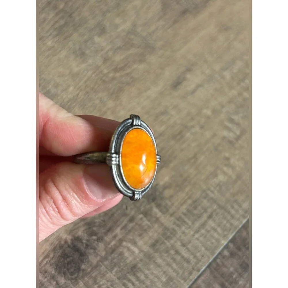 Untested women’s size 13.5 metal butterscotch amber or orange spiny oyster ring